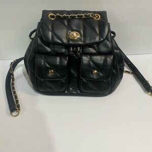 Black Quilted Turn lock Backpack with gold hardware